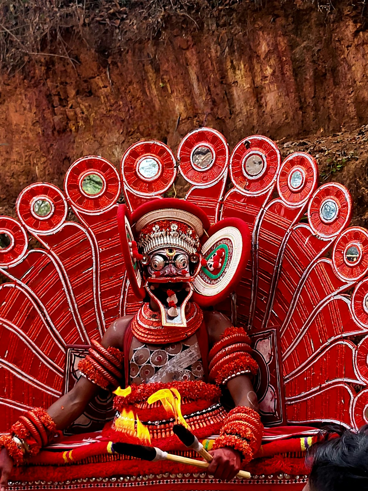 A Theyyam performer in full costume, Kerala